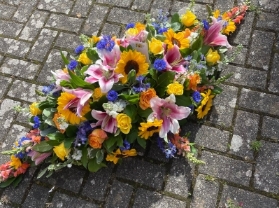 Sunflowers and lilies casket spray